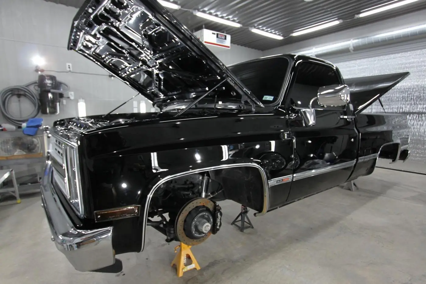 Black Chevrolet C10 prepped in the shop before coating