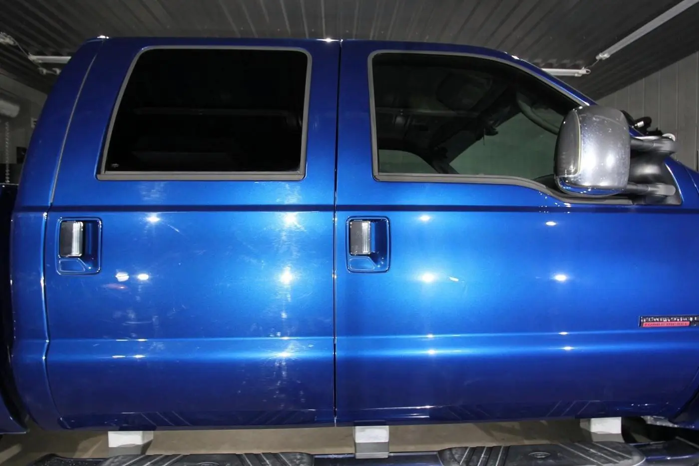 Corrected, glossy blue paint on a Ford F-250