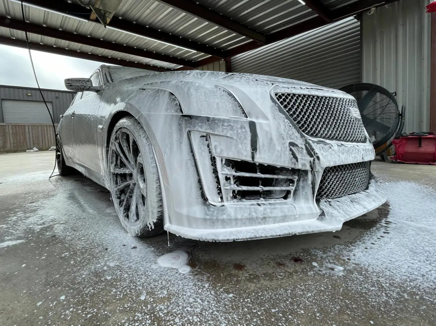 Cadillac CTS-V covered in thick foam during the wash