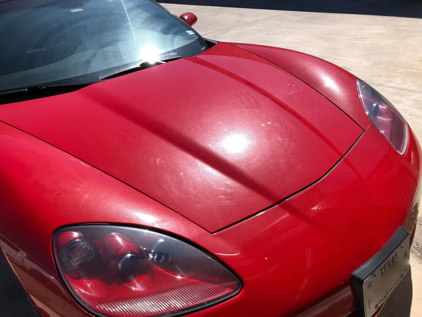 Faded, swirled red paint at the intake inspection